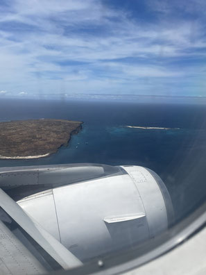 Looking out a plane window while flying into the Galapagos Islands
