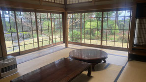 One of the rooms within the aroma-making facility, designed in the style of a traditional Japanese guest room with a view of a beautiful Japanese garden.