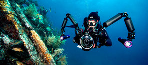 Photo of a diver shooting video for PADI course digital underwater videographer in Nusa Penida