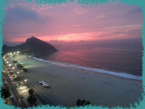 Copacabana at sunrise. Leme is at the back, near the hill.