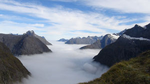 View from Gertrude Saddle. Milford Sound and Tasman Sea below clouds.