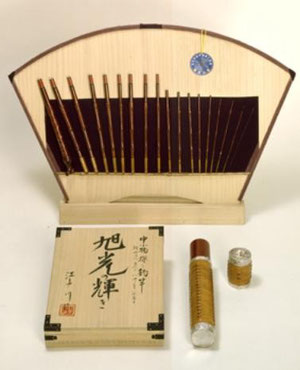 18 pieces (Length of 10ft, closed length of about 8inches) bamboo rod presented on a board with paulownia wood box signed by Edogawa II and scabbard decorated with silver and rattan. This is used for fishing small river fish.
