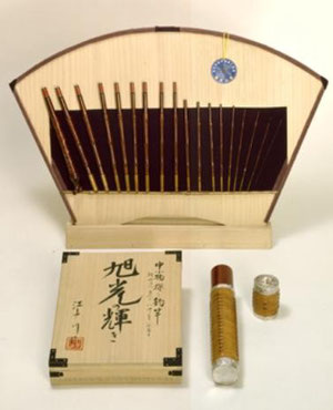  18 pieces (Length of 10ft, closed length of about 8inches) bamboo rod presented on a board with paulownia wood box signed by Edogawa II and scabbard decorated with silver and rattan. This is used for fishing small river fish.