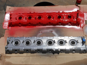 VALVE COVER WITH FIRST COAT OF WRINKLE PAINT.