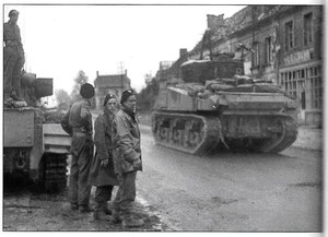 Tanks passing Le Bourg to Dreux and Paris (currently the D926). Matchpoint is the building in tha background. Click for StreetView.