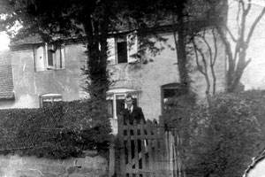 The Nailers Cottage with resident John Rounds 1931. Image 'All Rights Reserved' courtesy of Bernard Taylor of the Quinton Local History Society. See Acknowledgements to link to the website.