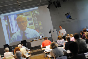 Dr. Rieger moderating a talk by Dr. Thompson