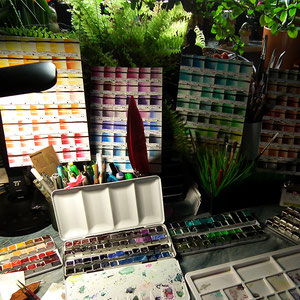 My workspace. It's vital for me to have the right atmosphere in order to paint and I can't live without my little 'forest' on my table. I love my plants ^_^ 