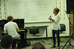 April Tini instructs vocal workshop class