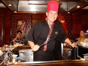 Our Chef at Teppanyaki Performs for his Dining Patrons