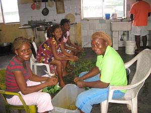 studens & staff cooking a meal for the community (the guys cook too, but not this day - in fact, Eric has been learning to cook some African food lately)