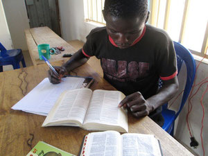 One of the students working on his homework assignment