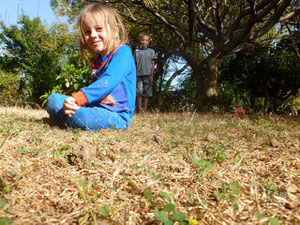 Naomi sitting in the grass in Jos
