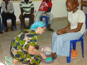 Cindy washing the feet of one of our students
