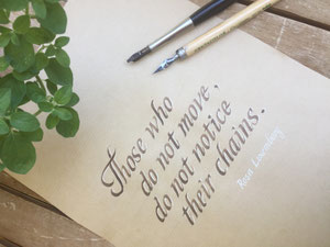 "Those who do not move, do not notice their chains" in humanistische Cursive