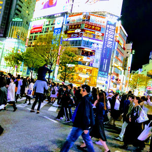 At Shibuya Crossing. Ever since the busy intersection known as the scramble crossing in front of Shibuya station was introduced in an American film Lost In Translation, it has become one of the must-see spots for visitors to Tokyo.