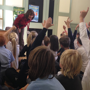 Jackie Burke, author of The Secrets of Grindlewood series for children, taking questions during a school visit