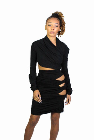 model wear twisted elegant top with cit out skirt