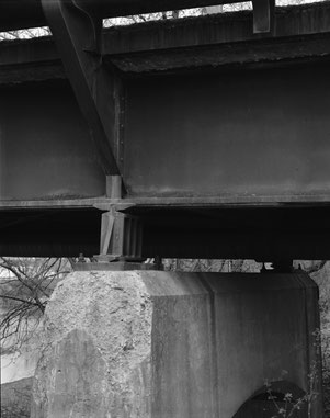 Concrete deterioration at the top of the Pier 1 near a movable shoe underneath the south main girder, looking northwest