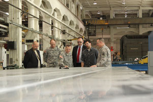 RIA-JMTC Commander, Col. James O. Fly, demonstrates the flatness of FSWed plates to the Department of Army Inspector General, Lt. Gen. Peter M. Vangjel, during a visit to the Rock Island Arsenal Joint Manufacturing and Technology Center on 31 January 2013