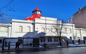 Riga Circus building with a white facade and a red cupola