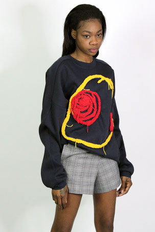 Women's wearing sweater and shorts