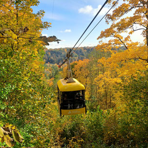Cable car in Sigulda, Latvia amidst autumn colours