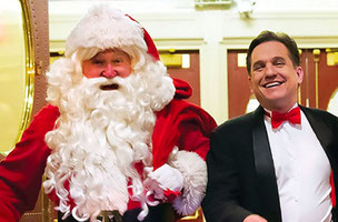 A close-up of Keith Lockhart with Santa