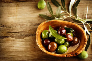 Olives and olive tree branches. Best Mediterranean extra virgin olive oils.