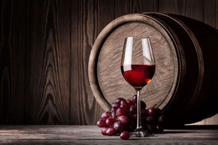 Red wine with grape and barrel. Best wine pairings. Mediterranean selection of signature wines, champagnes, cavas and liquors.
