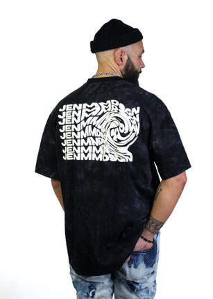 model wearing black batik print t-shirt with a bold white vertigo print on the back