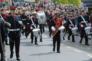 Coventry Corps of Drums marching for a large crowd in Stratford-Upon-Avon