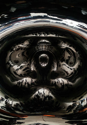 reflection of a lot of people at the cloud gate, in the bean in chicago