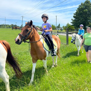 Getting ready for a trail ride at Pony Gang Camp 