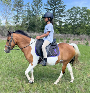 Getting ready for a trail ride at Pony Gang Camp 