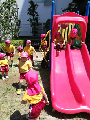 A picture of the students playing at the park