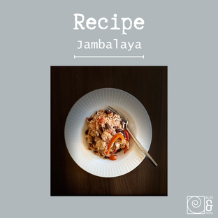 photo of a white plate with jambalaya and a fork