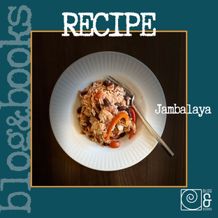 photo of a white plate with jambalaya and a fork