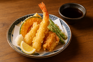 Assorted tempura platter with shrimp, pumpkin, sweet potato, and green beans, crisp golden batter, served with dipping sauce.