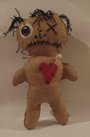 34 cm (13.5") stuffed doll, with a customised skull pin.