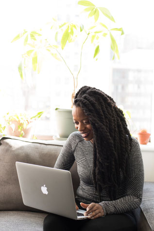 woman attending online therapy session at home