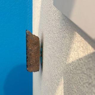 The object is fixed to the wall in a floating manner.
