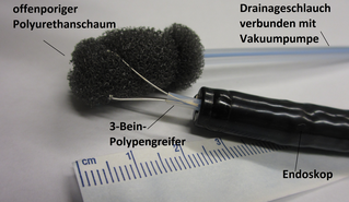 Grasping the openpore foam with a polyp-grasper