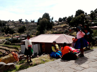 © Winifred. The women in Taquile Island, Puno providing support and friendship to one another.