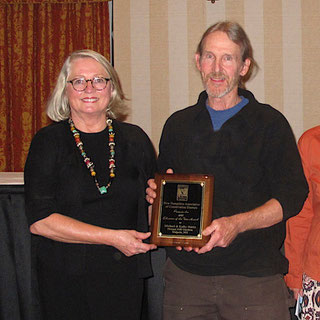 Michael Nerrie of Distant Hill Gardens is show here accepting the 2015 award from Linda Brownson, the president of the NHACD.