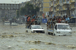 Pakistani commuters travel on a flooded street following a heavy rainfall in Karachi, Pakistan, Thursday, Aug. 31, 2017. (AP Photo/Shakil Adil)