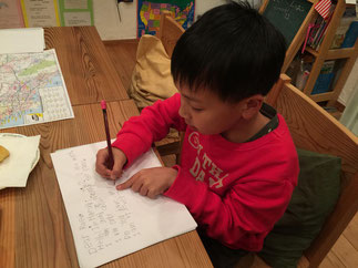 H-kun neatly writing his letters for his pen pals