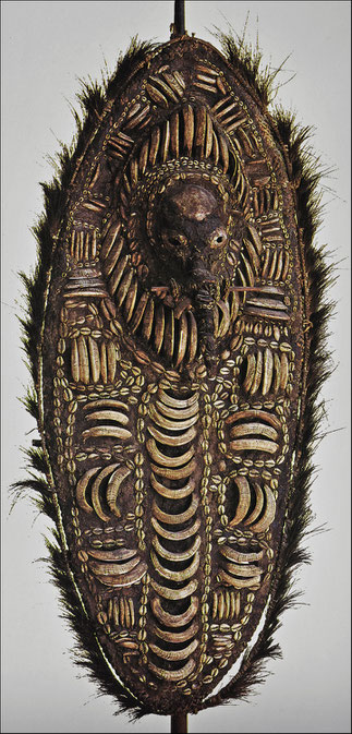 Rare shield-like representation of an ancestor • Keram and Yuat rivers, Lower Sepik, New Guinea • Bone, feathers, cane, shell, wood, and wax or resin • H. 156.5 cm • Private collection • Reproduced in Anthony JP Meyer 'Oceanic Art', © 1995 Köneman Verlags