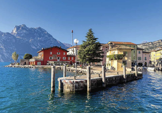 Hingucker: Mit einem Postkartenmotiv empfängt Torbole am alten Zollhaus »Casa del Dazio« jeden Besucher des Gardasees.