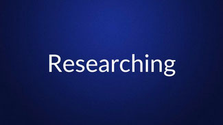 White text reading “Researching” is centered on a plain dark blue background.